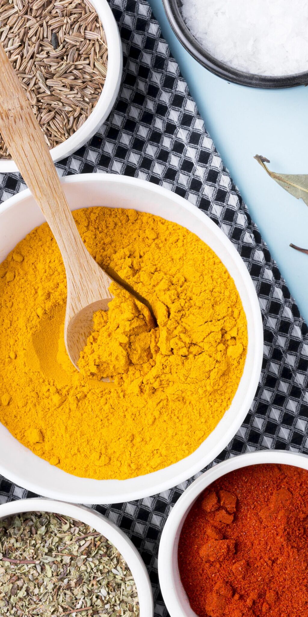 flat-lay-bowls-with-spices-leaves